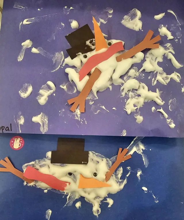 Children’s art project with paint and paper cutouts